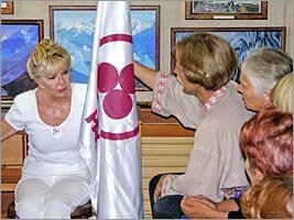 Alicia Rodriges tells about value of the Banner of Peace to visitors of the Roerich's museum of Uimon valley